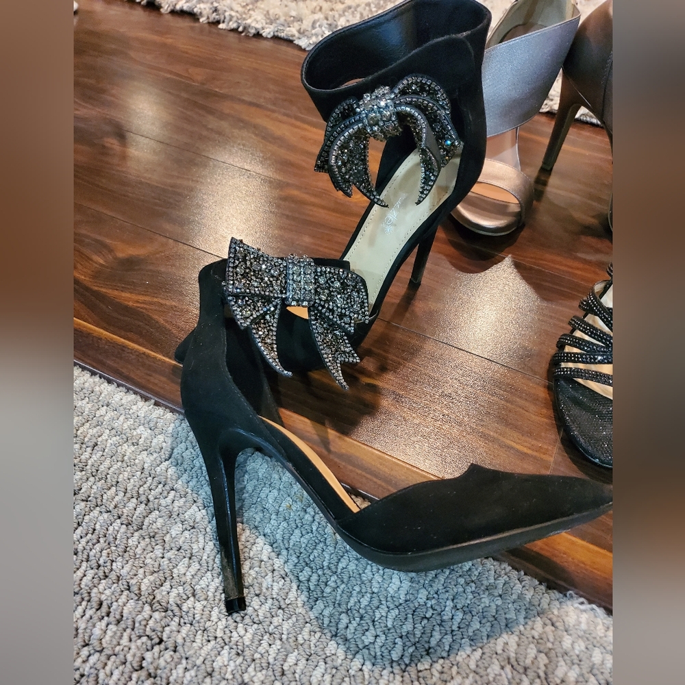 Black Suede Heels W/ A  Beaded Bow On The Ankle Strap That Closes W/ Velcro